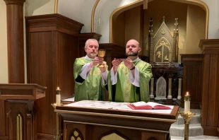Father Eric Seitz says Mass, with his father, Deacon Ben Seitz, assisting as deacon. Courtesy photo.